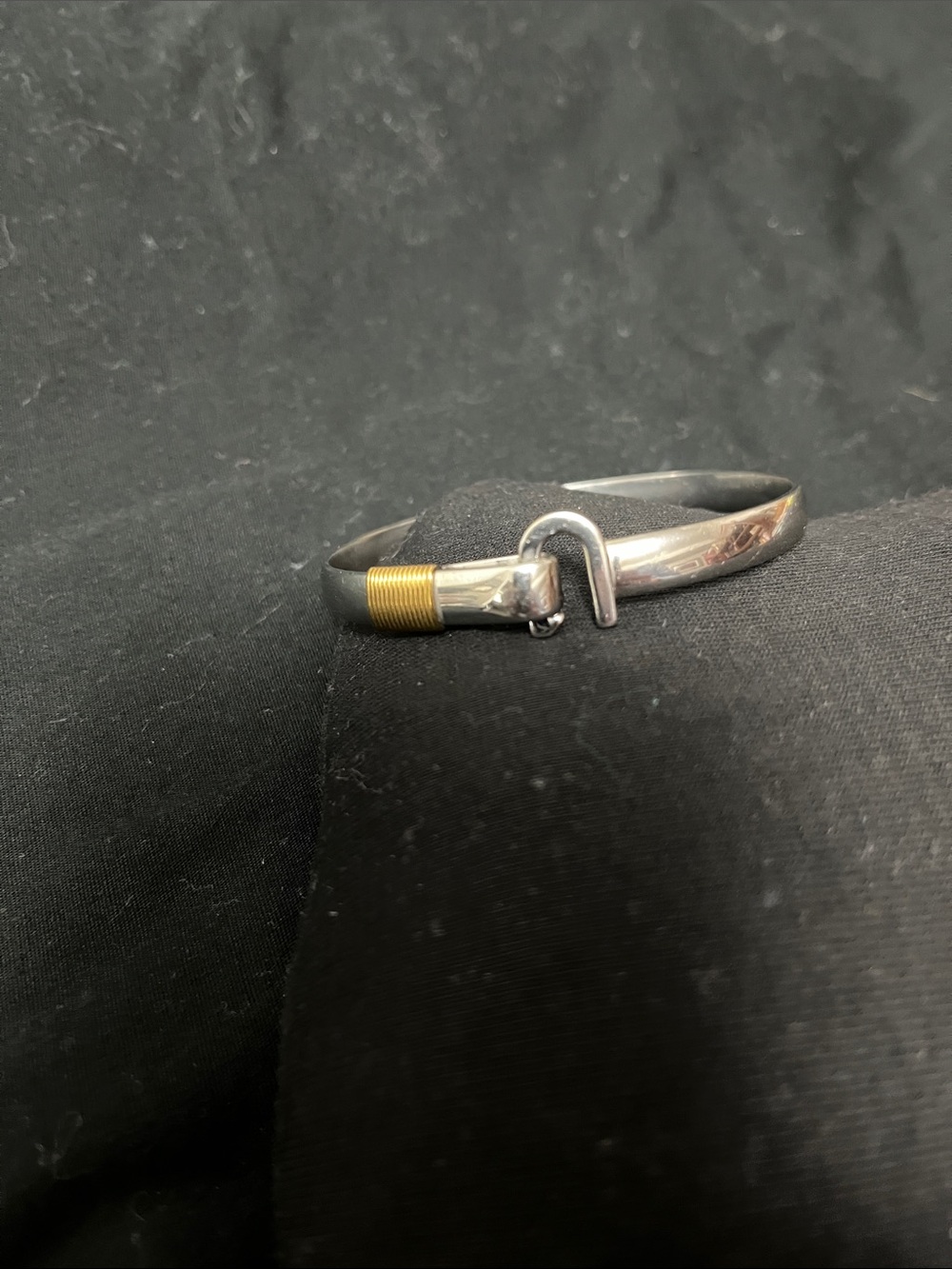 Sleek Silver Bracelet with Gold Accent Hook
